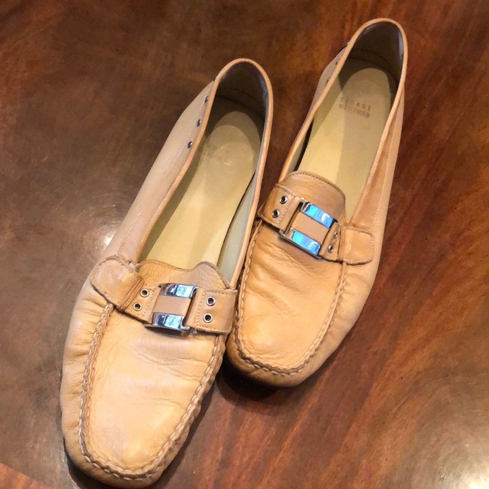 Tan flat loafers by Stuart Weitzman